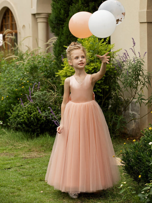 The bodice is crafted from delicate matte satin, while the skirt consists of multiple layers of soft tulle. It features great draping, light volume and no bulky feel.