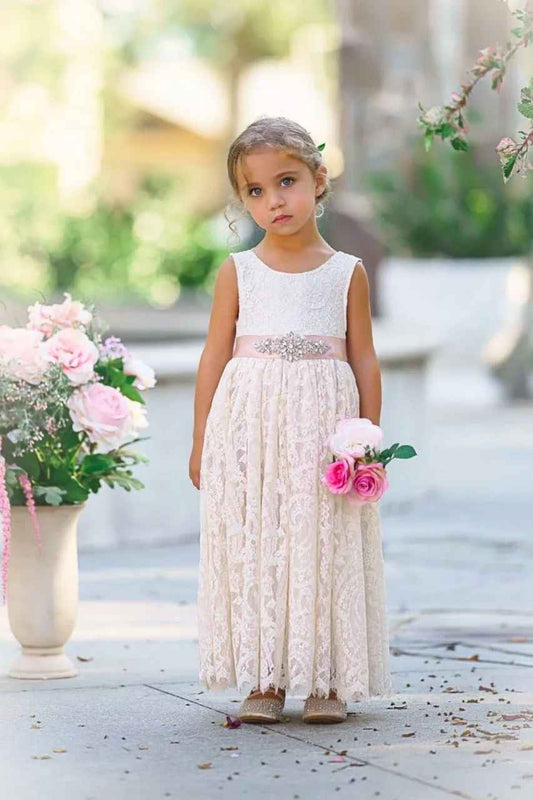Sleeveless lace flower girl dress with round neckline.