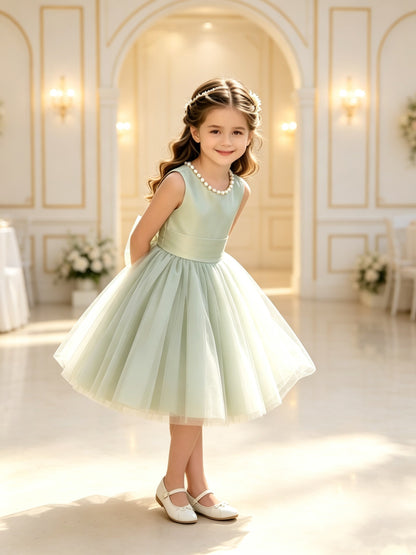 The bodice is crafted from fine matte satin, and the skirt is made of multiple layers of soft tulle. It features great draping, light and full without being bulky.
