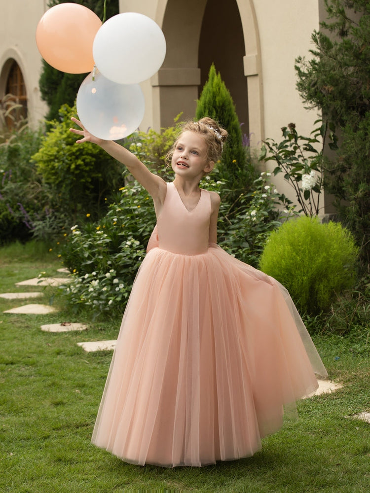 The bodice is crafted from delicate matte satin, while the skirt consists of multiple layers of soft tulle. It features great draping, light volume and no bulky feel.