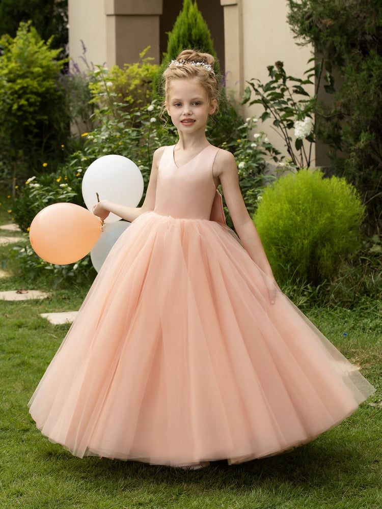 The bodice is crafted from delicate matte satin, while the skirt consists of multiple layers of soft tulle. It features great draping, light volume and no bulky feel.
