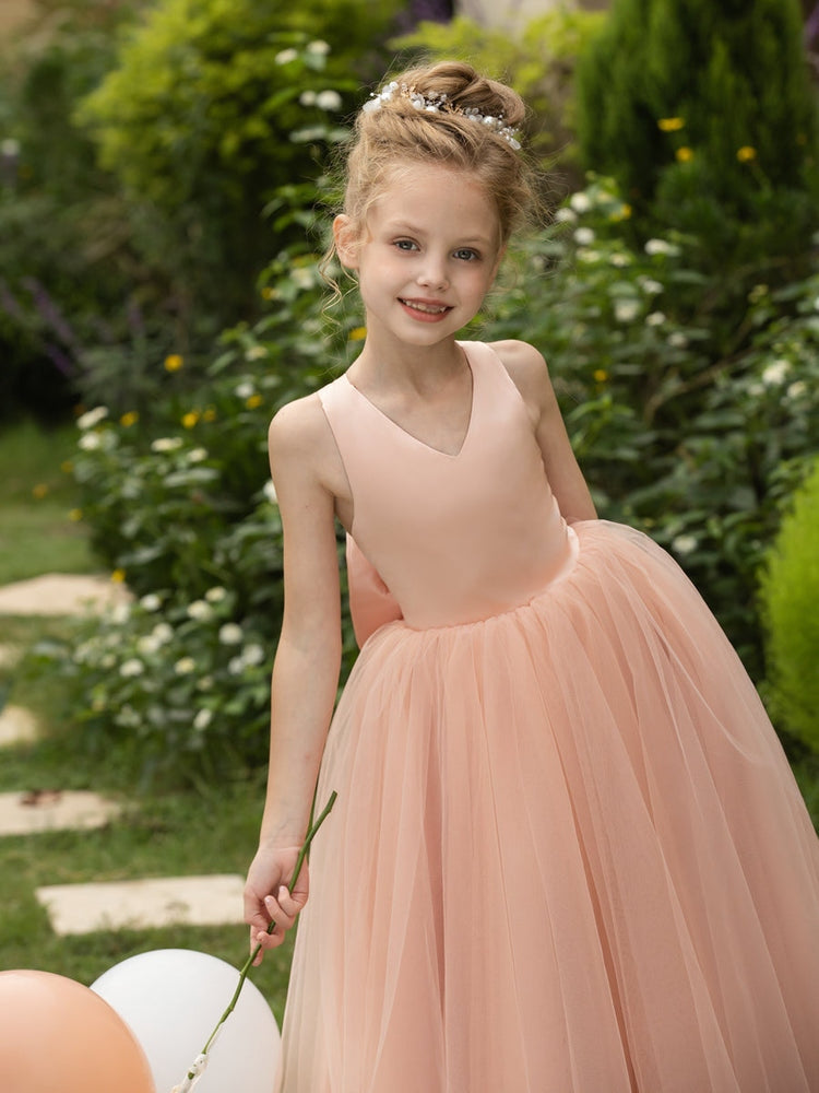 The bodice is crafted from delicate matte satin, while the skirt consists of multiple layers of soft tulle. It features great draping, light volume and no bulky feel.