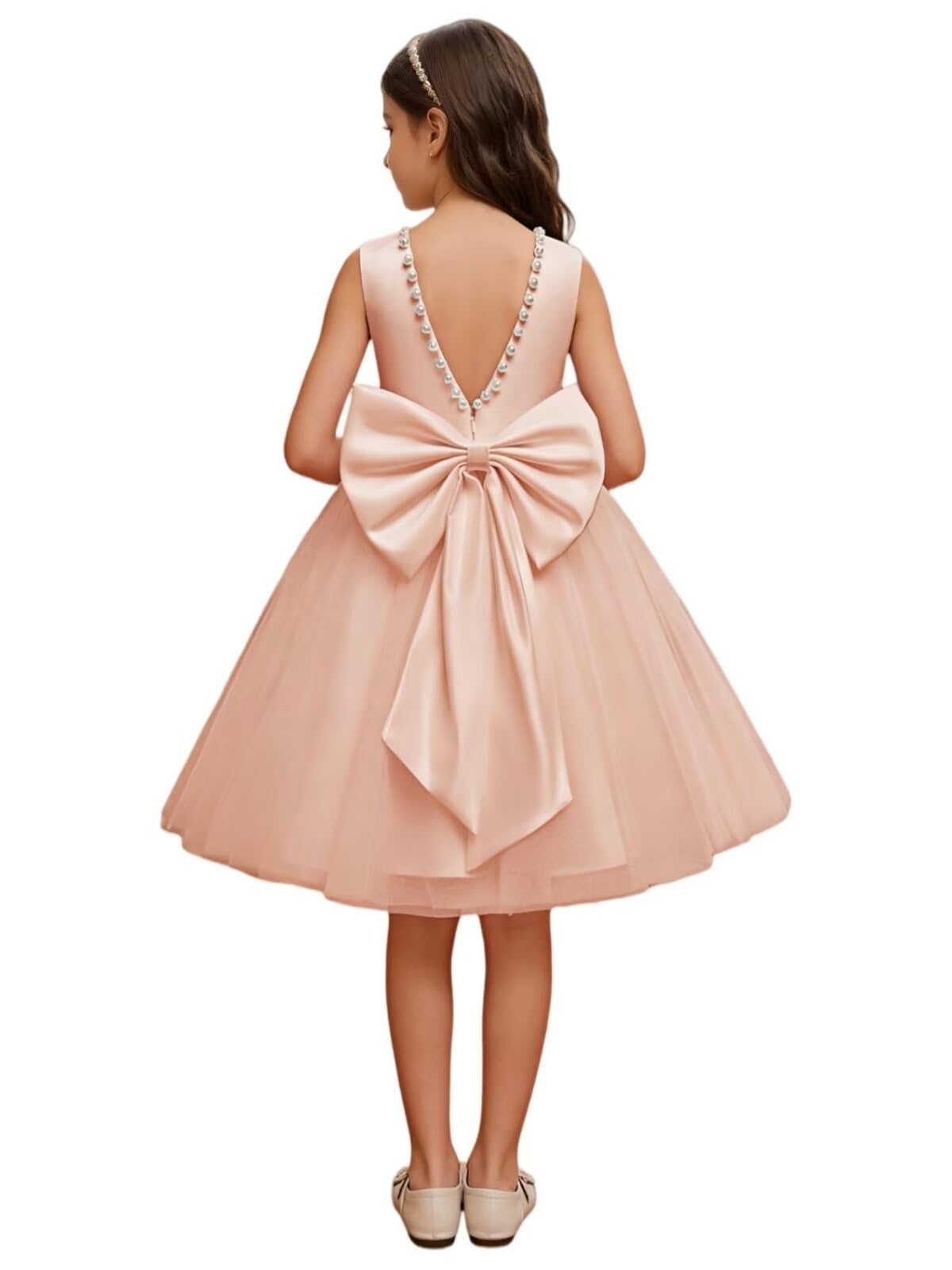 The bodice is crafted from fine matte satin, and the skirt is made of multiple layers of soft tulle. It features great draping, light and full without being bulky.