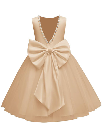 The bodice is crafted from fine matte satin, and the skirt is made of multiple layers of soft tulle. It features great draping, light and full without being bulky.