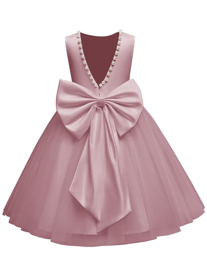The bodice is crafted from fine matte satin, and the skirt is made of multiple layers of soft tulle. It features great draping, light and full without being bulky.
