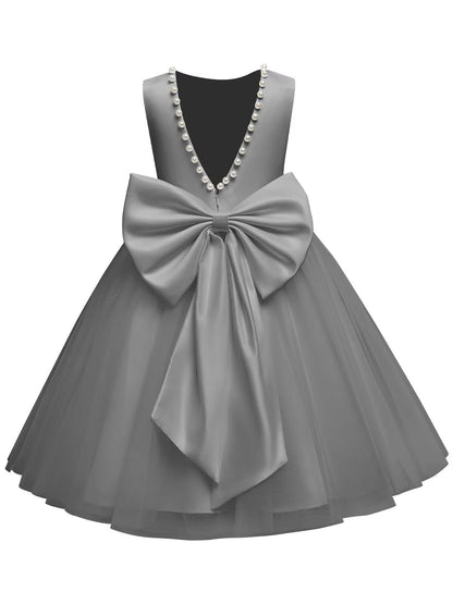 The bodice is crafted from fine matte satin, and the skirt is made of multiple layers of soft tulle. It features great draping, light and full without being bulky.