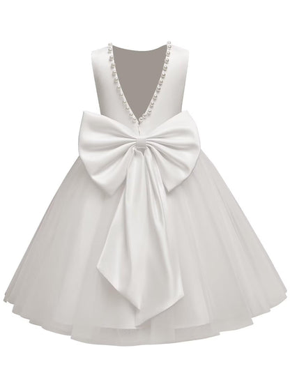 The bodice is crafted from fine matte satin, and the skirt is made of multiple layers of soft tulle. It features great draping, light and full without being bulky.