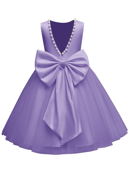 The bodice is crafted from fine matte satin, and the skirt is made of multiple layers of soft tulle. It features great draping, light and full without being bulky.