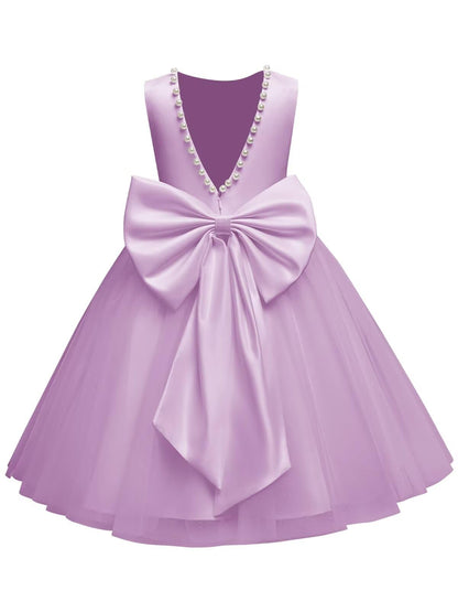The bodice is crafted from fine matte satin, and the skirt is made of multiple layers of soft tulle. It features great draping, light and full without being bulky.