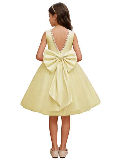 The bodice is crafted from fine matte satin, and the skirt is made of multiple layers of soft tulle. It features great draping, light and full without being bulky.